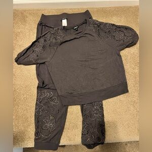 Grey express lounge outfit with cutout details. Soft, stylish outfit.